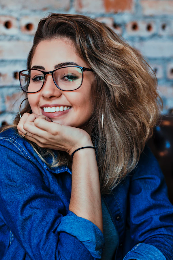 Close-up of woman wearing black eyeglasses